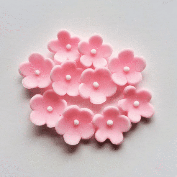 Kwiaty MINI cukrowe różowe śr. 1,5 cm opak. 10 szt.